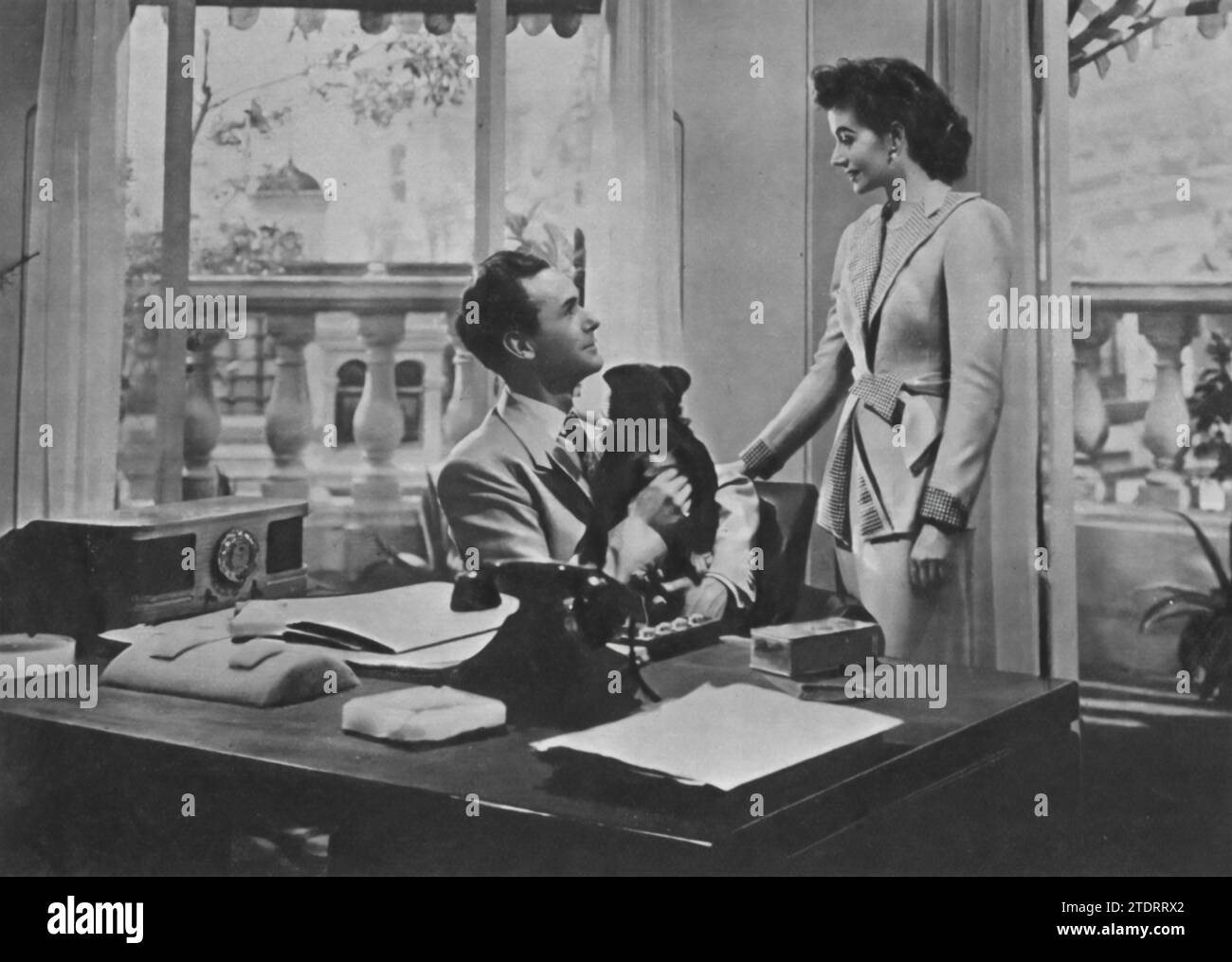 Margaret Lockwood and Griffith Jones star in 'Look Before You Love' (1948), also known as 'An Ideal Husband' in the United States. In this British drama, Lockwood plays a Brazilian woman who marries an Englishman, portrayed by Jones. Their story unfolds with a blend of romance and intrigue, showcasing Lockwood's versatility as an actress and the charming on-screen dynamic between the two stars. Stock Photo