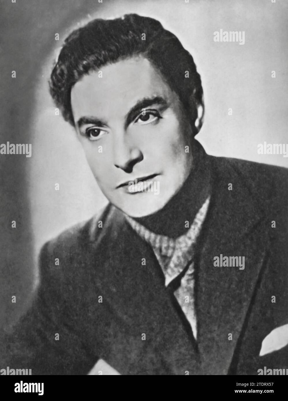 Robert Donat, born on March 18, 1905, and passing away on June 9, 1958, was a celebrated British actor known for his compelling performances in classic cinema. He gained notable acclaim for his role in 'Perfect Strangers' (1945), also known as 'Vacation from Marriage.' In this film, Donat portrays a man whose marriage is transformed by the separate experiences he and his wife undergo during World War II. Stock Photo