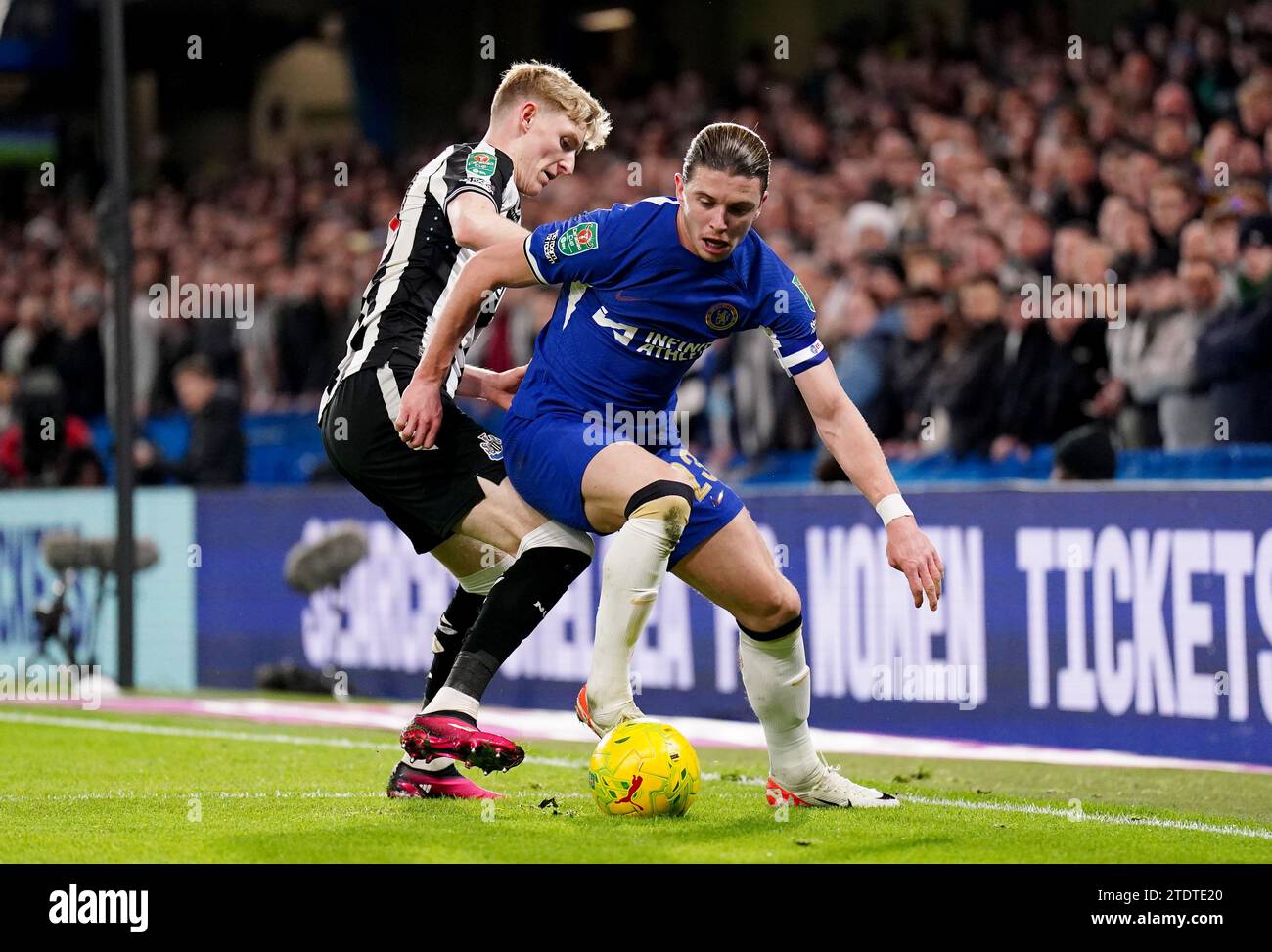 Chelsea's Conor Gallagher holds off Newcastle United's Anthony Gordon during the Carabao Cup quarter final match at Stamford Bridge, London. Picture date: Tuesday December 19, 2023. Stock Photo