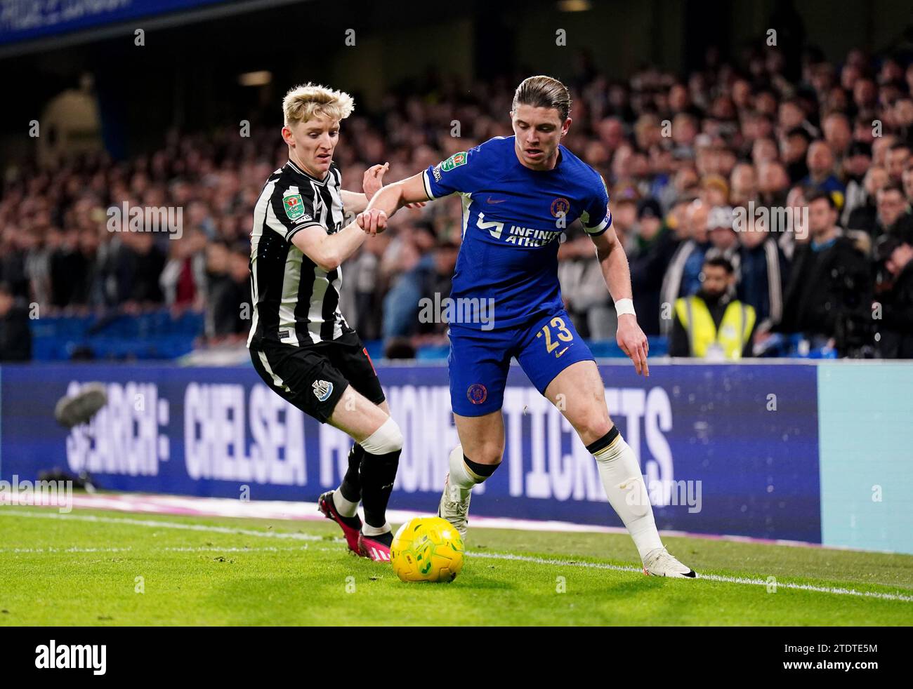 Chelsea's Conor Gallagher holds off Newcastle United's Anthony Gordon during the Carabao Cup quarter final match at Stamford Bridge, London. Picture date: Tuesday December 19, 2023. Stock Photo