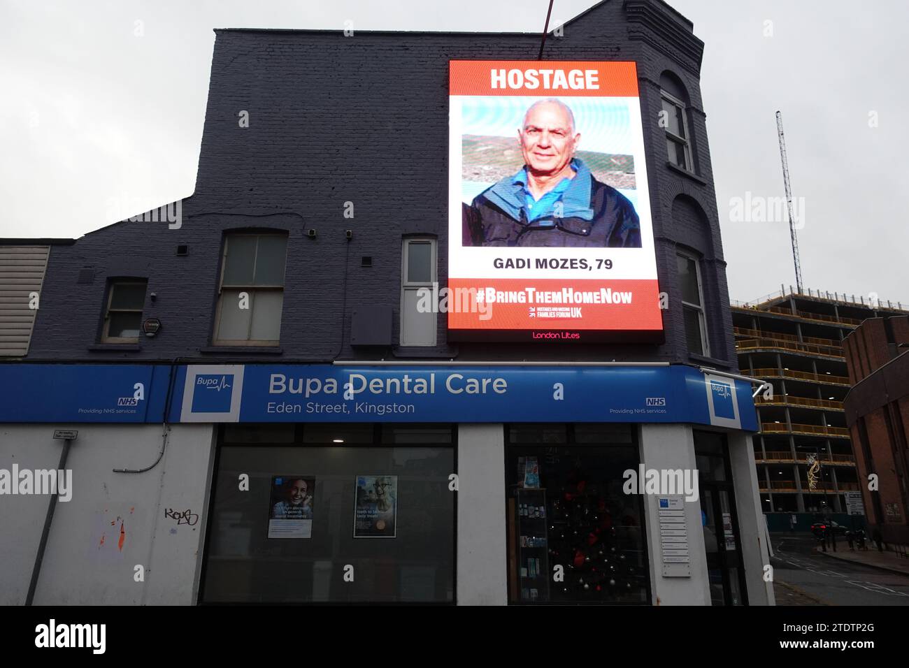 An unusual sight on a digital advertising screen in central Kingston upon Thames - the images and names of the hostages being held by Hamas. Stock Photo