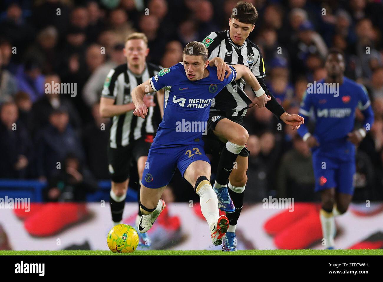 19th December 2023; Stamford Bridge, Chelsea, London, England: Carabao Cup Football, Chelsea versus Newcastle United; Lewis Miley of Newcastle United challenges Conor Gallagher of Chelsea Stock Photo