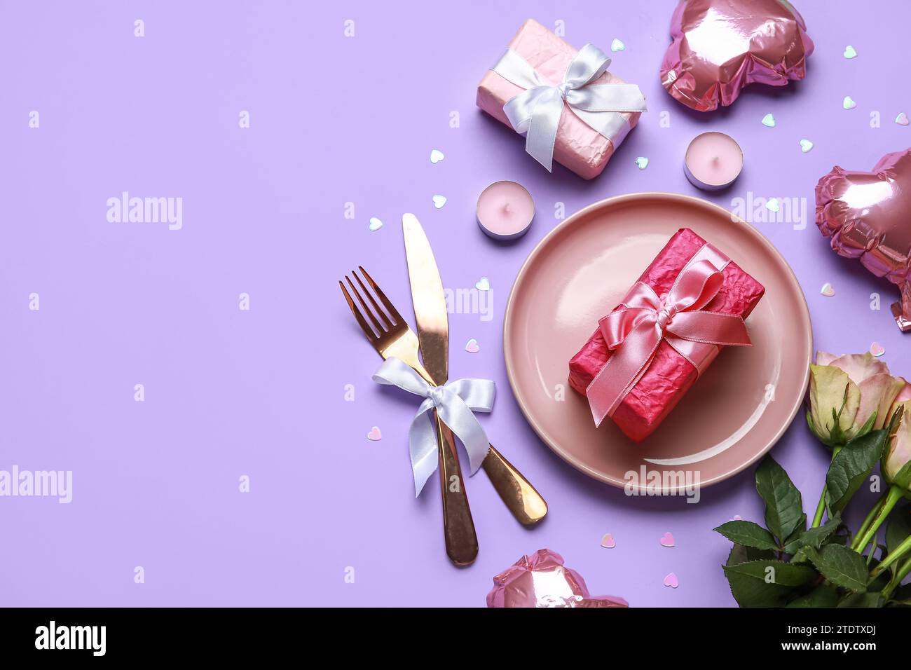 Beautiful table setting for Valentine's Day with pink roses, gifts and ...