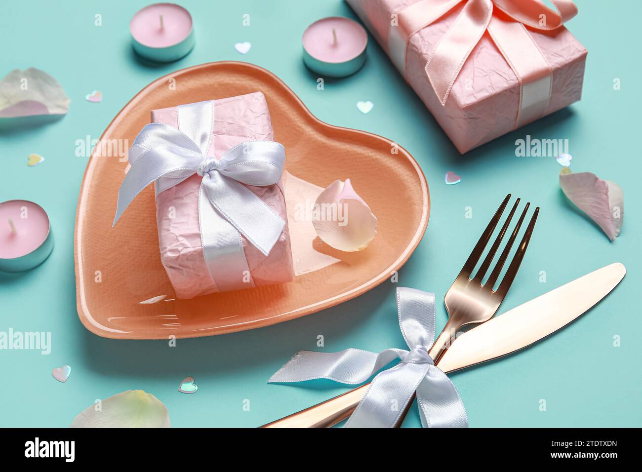 Beautiful table setting for Valentine's Day with pink rose petals ...