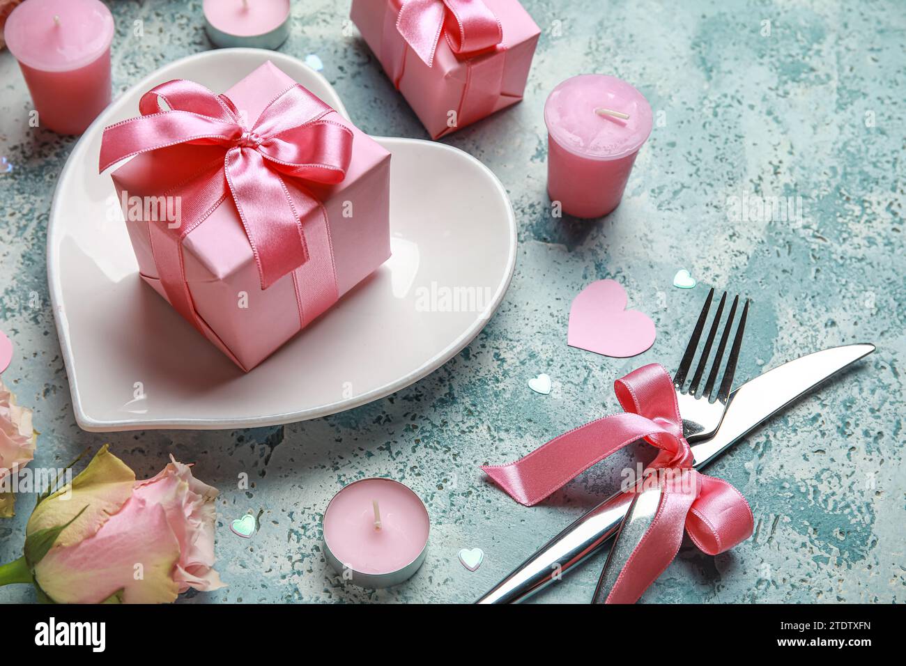 Beautiful table setting for Valentine's Day with pink roses, candles ...
