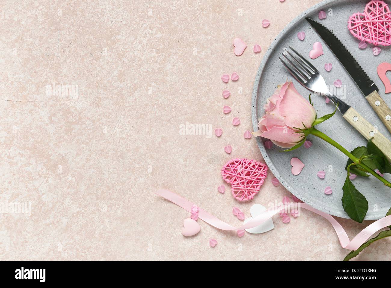 Beautiful table setting for Valentine's Day with pink hearts and rose ...
