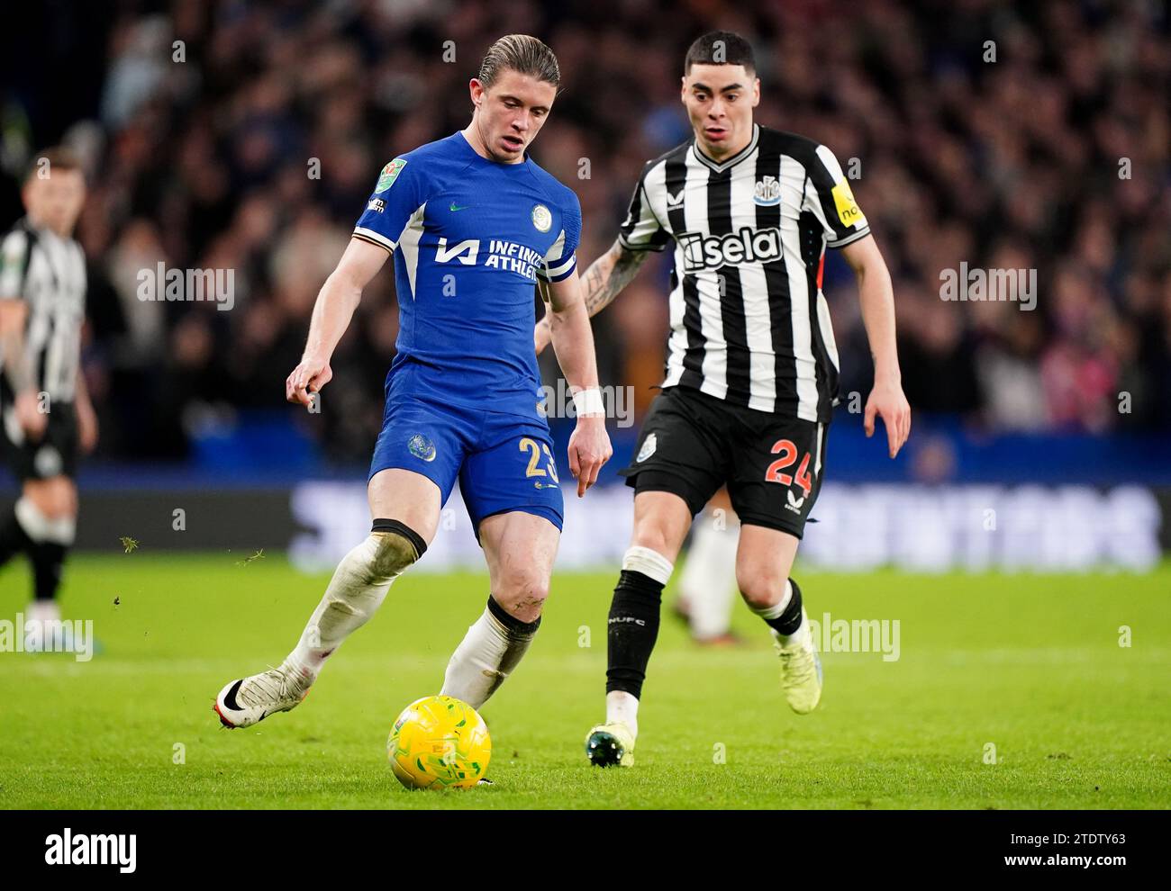Chelsea's Conor Gallagher battles for the ball against Newcastle United's Miguel Almiron during the Carabao Cup quarter final match at Stamford Bridge, London. Picture date: Tuesday December 19, 2023. Stock Photo