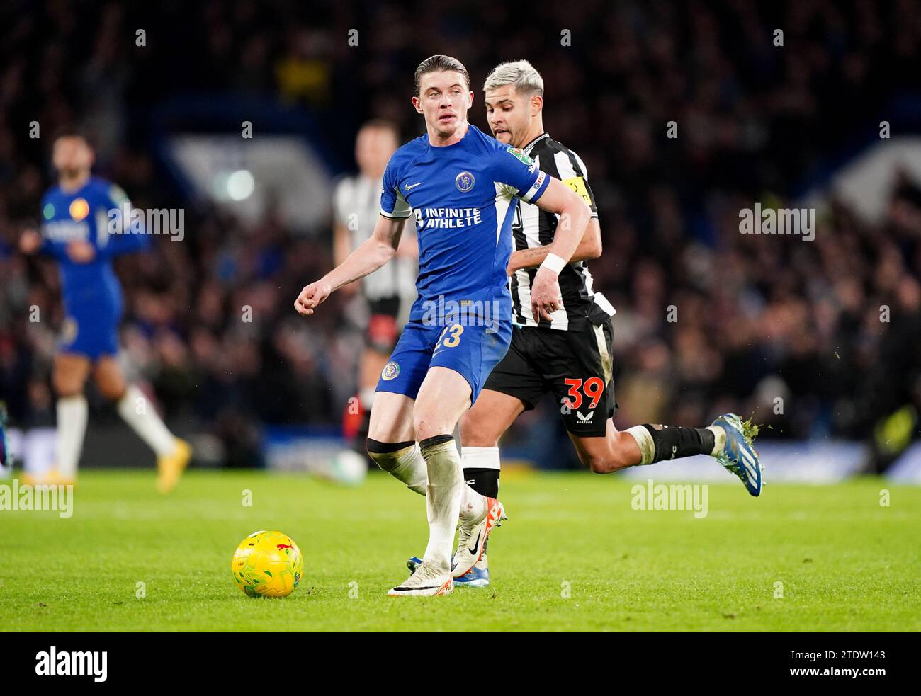 Chelsea's Conor Gallagher breaks past Newcastle United's Bruno Guimaraes during the Carabao Cup quarter final match at Stamford Bridge, London. Picture date: Tuesday December 19, 2023. Stock Photo