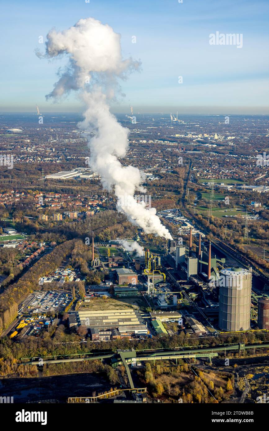 Aerial view, ArcelorMittal Bottrop and Prosper-Haniel colliery with smoke cloud, surrounded by autumnal deciduous trees, Welheim, Bottrop, Ruhr area, Stock Photo