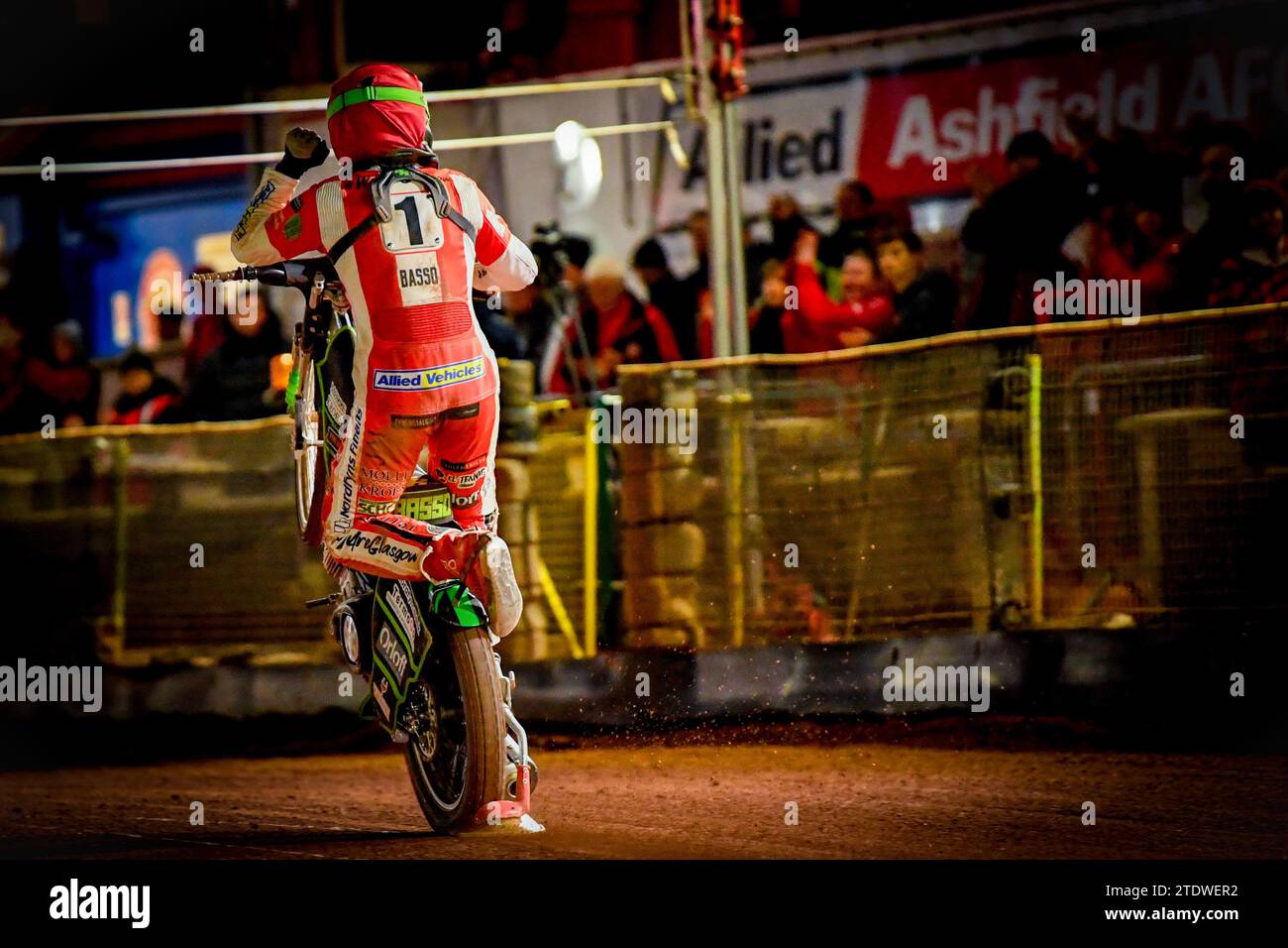 Glasgow Tigers Danish Speedway Rider Ben Basso Celebrating A Race Win With A Wheelie In Front Of Fans At The Glasgow Speedway Track Stock Photo