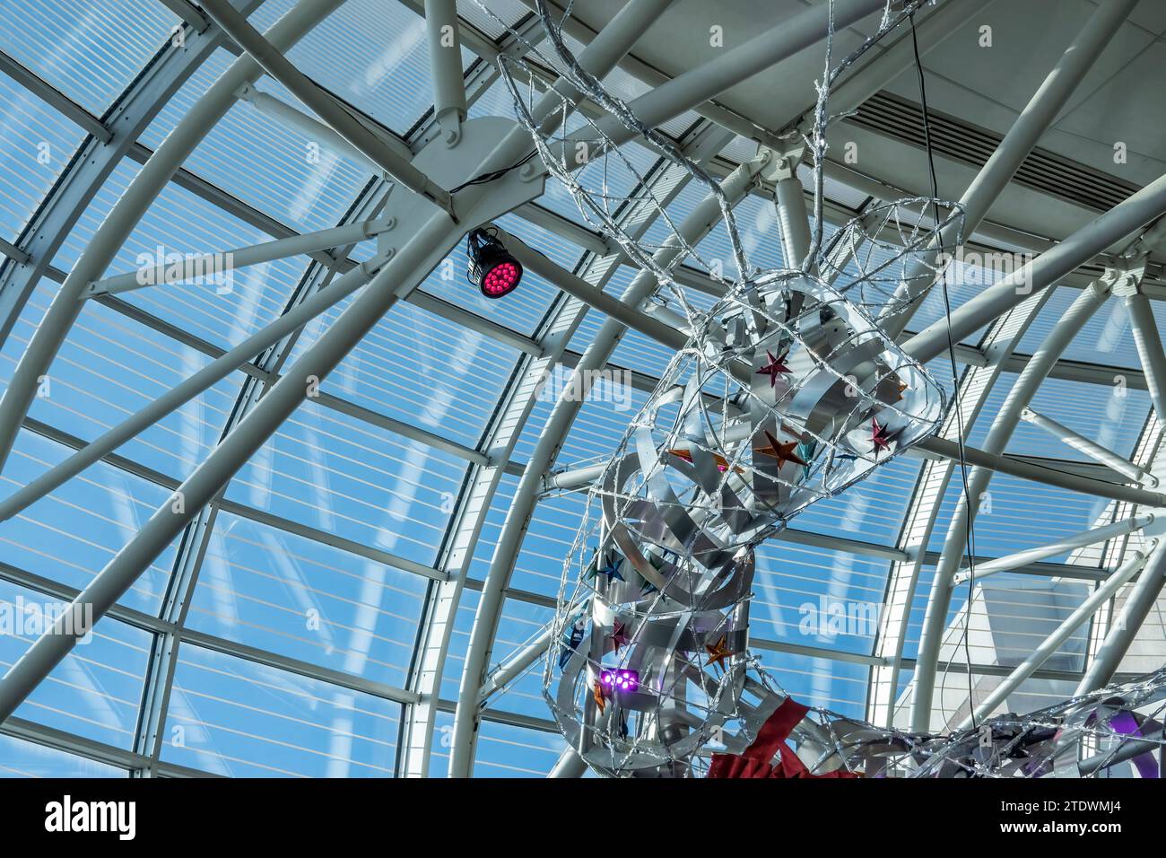 Looking up at the giant modern reindeer statue during Christmas at Charlotte Douglas International Airport in Charlotte, North Carolina. Stock Photo