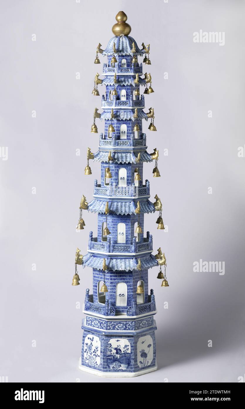 Model of a pagoda, anonymous, c. 1765 - c. 1775 Octagonal porcelain porcelain consisting of 8 parts: a base, six floors and a porcelain peak of two golden balls. Painted in underly glaze blue and on the glaze gold. The basis of the pagoda shows images of a fool and a flowering plant (Lotus, peony). It contains an openwork porcelain gate that is open on one side. The floors are painted in underly glaze blue with bricks and closed doors interspersed with saved doors. Always a balcony fence around. The roof with on the corner points always a golden carp on which an iron chain with a bell hangs. B Stock Photo