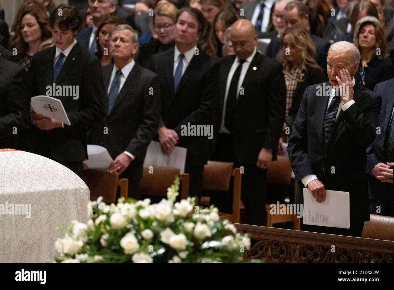US President Joe Biden (R) attends the memorial service for former US ...