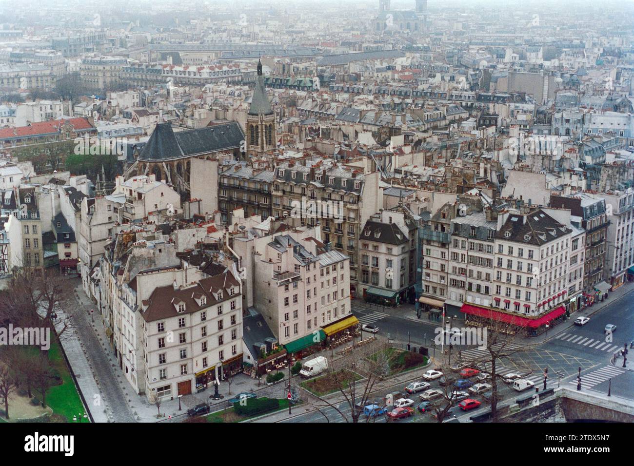 Grainy archival film photograph of the historic center of Paris France