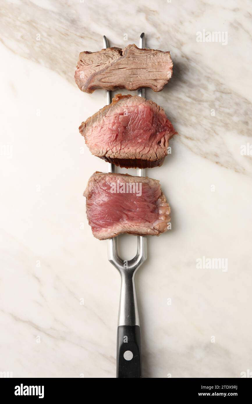 Delicious sliced beef tenderloin with different degrees of doneness on