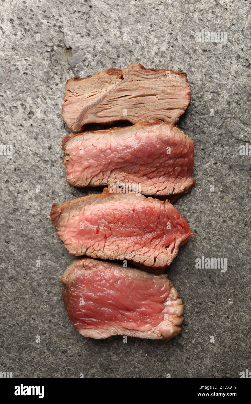 Delicious sliced beef tenderloin with different degrees of doneness on