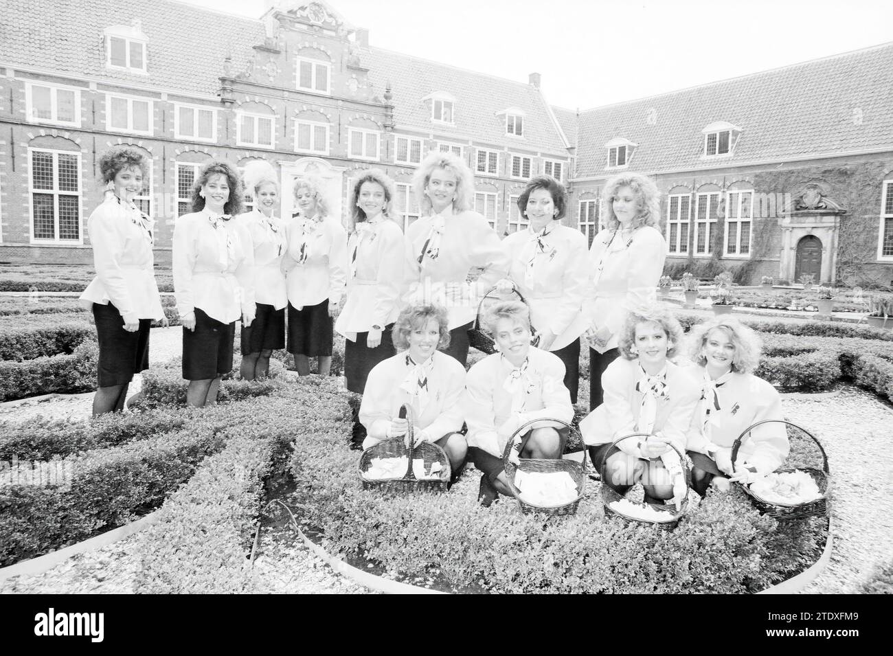 Presentation of flower girls at the Frans Hals museum, dressed by Frans Molenaar who is also in the group photo in the courtyard., Flowers and flower girls, Haarlem, Groot Heiligland 62, The Netherlands, 23-03-1988, Whizgle News from the Past, Tailored for the Future. Explore historical narratives, Dutch The Netherlands agency image with a modern perspective, bridging the gap between yesterday's events and tomorrow's insights. A timeless journey shaping the stories that shape our future. Stock Photo