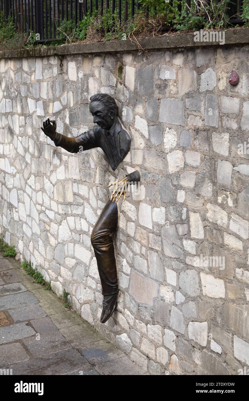 Dutilleul - The Passer Through Walls or Le Passe-Muraille Sculpture at Place Marcel Aymé in Montmartre, Paris, France Stock Photo