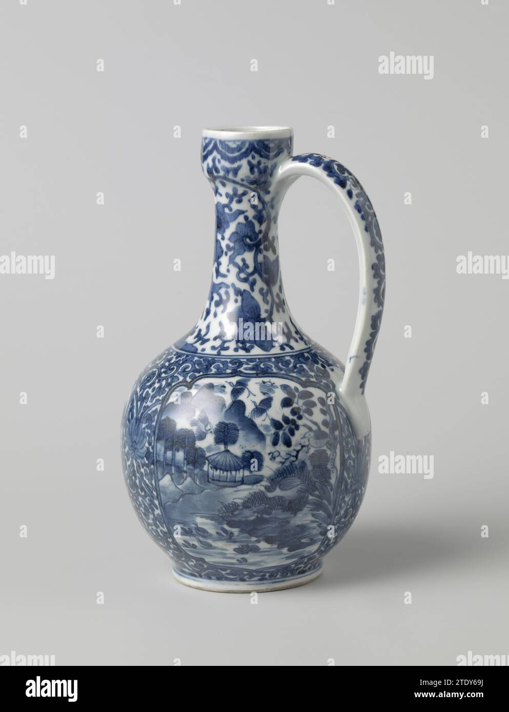 Ewer with landscapes in panels and floral scrolls, anonymous, anonymous, c. 1655 - c. 1680 Can be made of porcelain with spherical body, C-shaped ear and small, triangular spout from the edge, painted in underlaze blue. The belly is covered with 'Karakusa' vines containing three scalloped cartouches. The middle catouche with two men in a landscape, one with a parasol and a fan, the other with a closed parasol and a dog. To the left of this a cartouche with cranes in a landscape with trees and rocks. The third cartouche with different birds in a landscape with a pavilion, mountains and a pond. Stock Photo