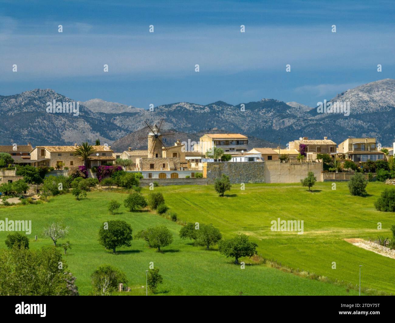 Aerial view of the town of Sineu and fields and rural surroundings in spring. In the background, the Serra de Tramuntanta mountain range (Mallorca) Stock Photo
