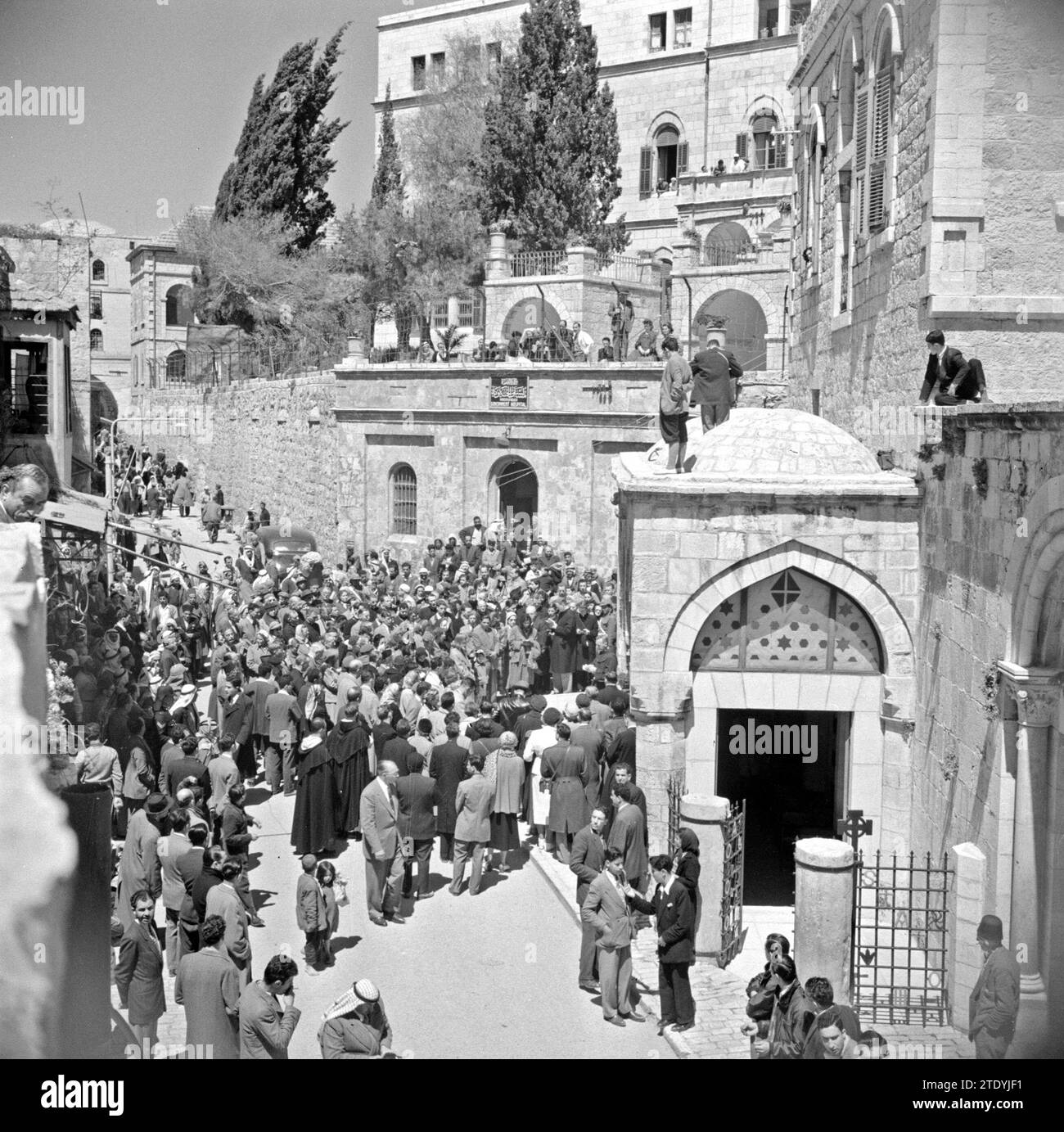 Pilgrims and tourists on Good Friday in the cloister procession in