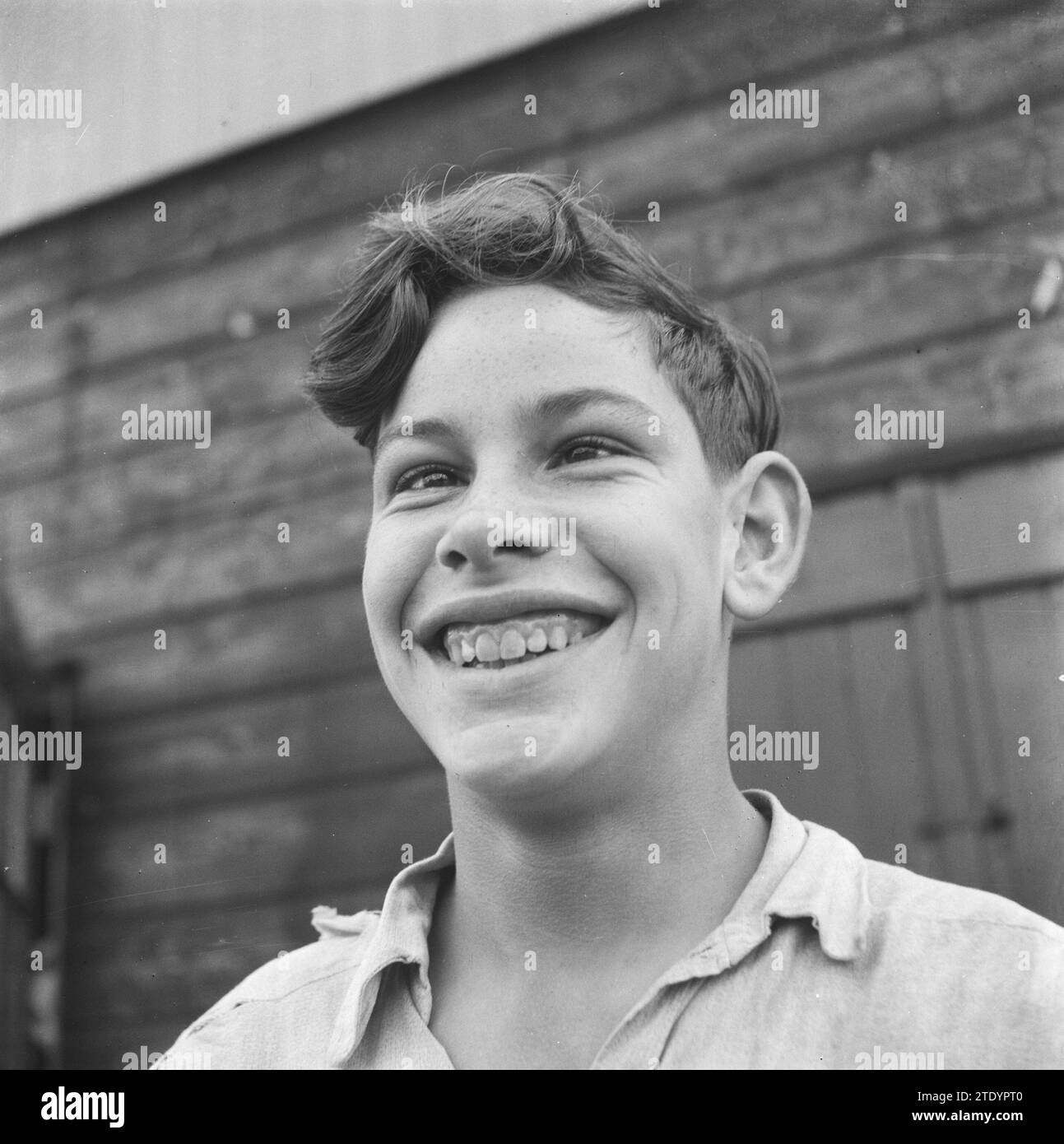 Portrait of a smiling and cross-eyed boy ca. October 1945 Stock Photo