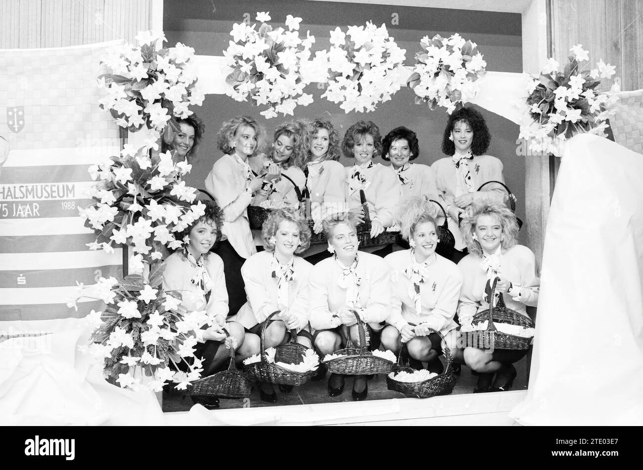 Presentation of flower girls at the Frans Hals museum, dressed by Frans Molenaar who is also in the group photo in the courtyard., Flowers and flower girls, Haarlem, Groot Heiligland 62, The Netherlands, 23-03-1988, Whizgle News from the Past, Tailored for the Future. Explore historical narratives, Dutch The Netherlands agency image with a modern perspective, bridging the gap between yesterday's events and tomorrow's insights. A timeless journey shaping the stories that shape our future. Stock Photo