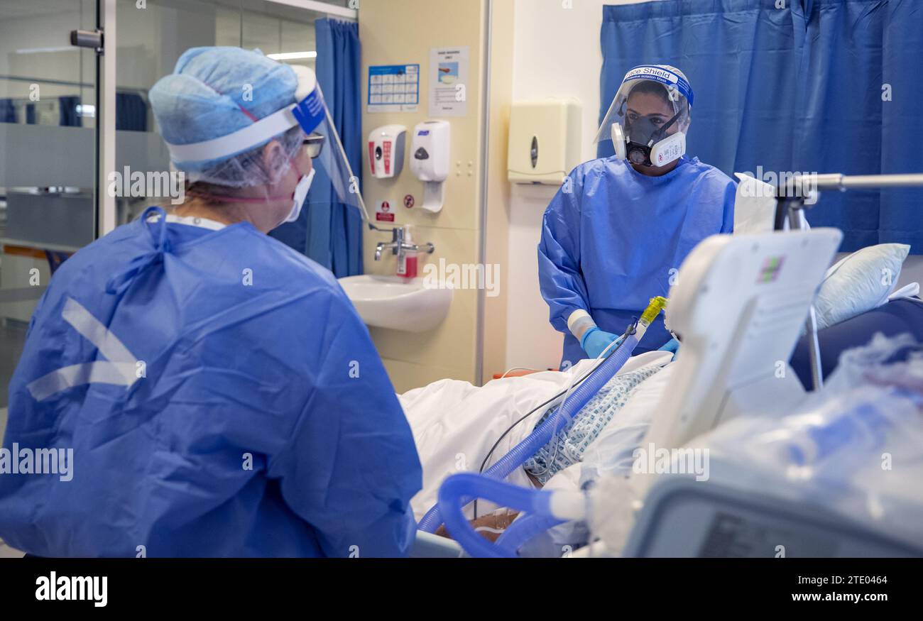 File photo dated 20/10/23 of health workers wearing full personal