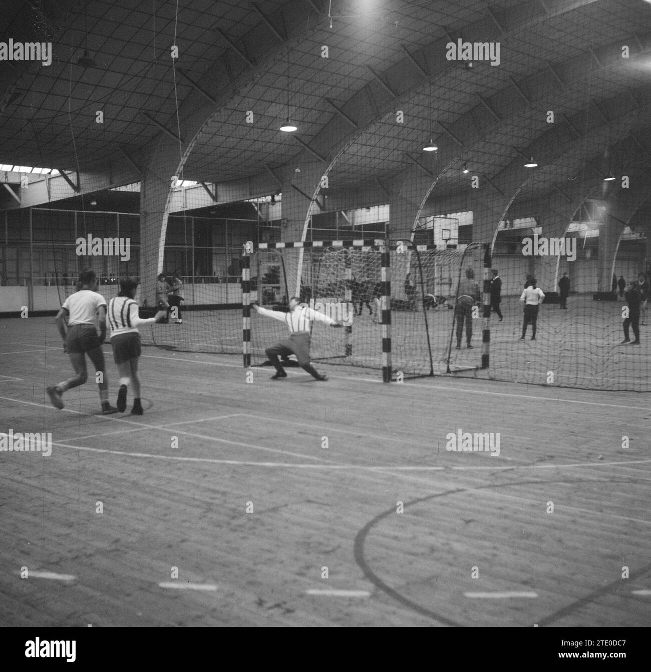 School Christmas tournament in the RAI organized by Sazabo school sport, young men playing handball ca. December 24, 1962 Stock Photo