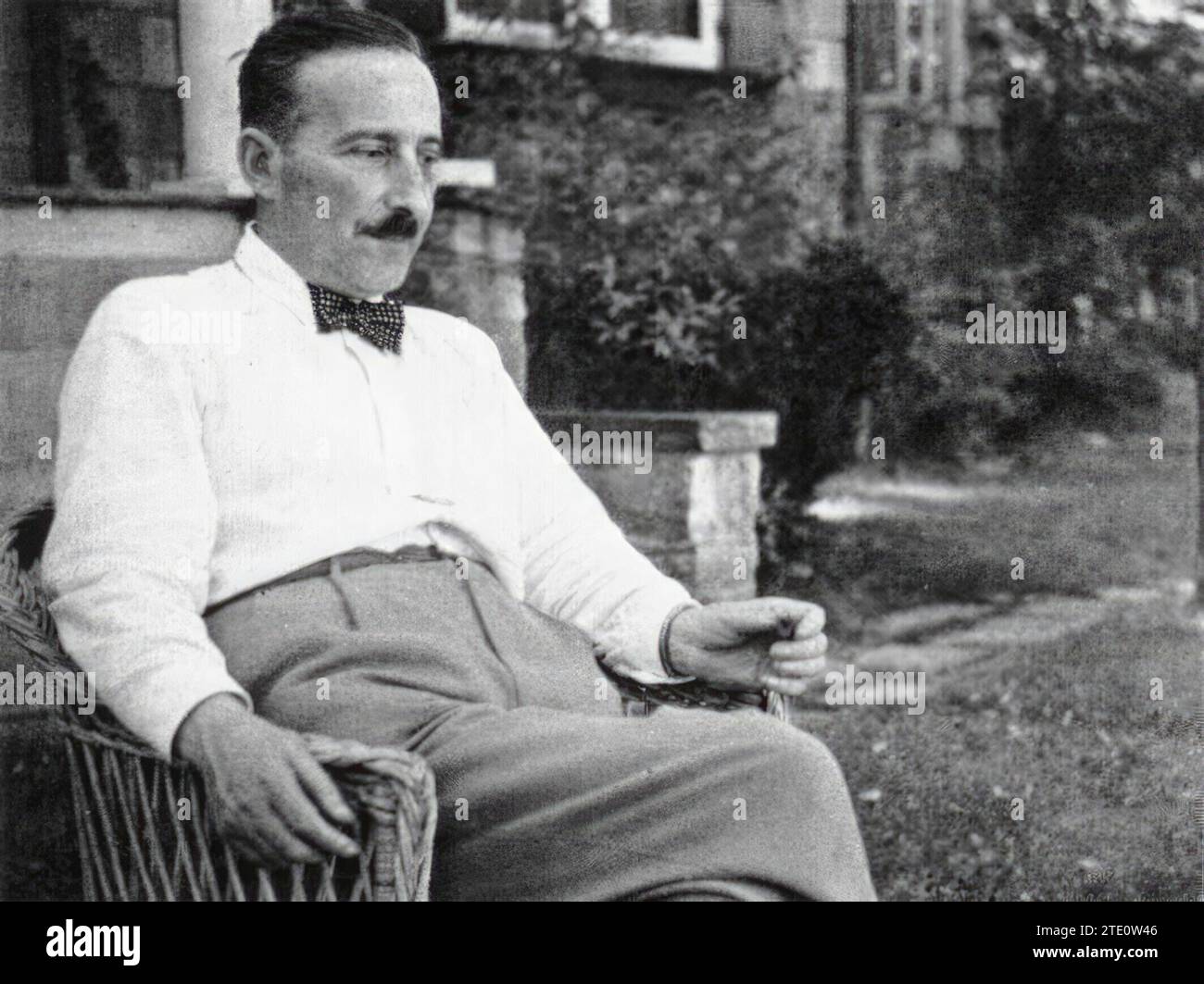 12/31/1929. Austrian writer Stefan Zweig relaxes sitting in the entrance of his house. Credit: Album / Archivo ABC Stock Photo