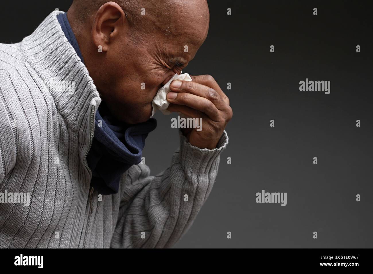 man catching the cold and flu man blowing nose after catching a cold