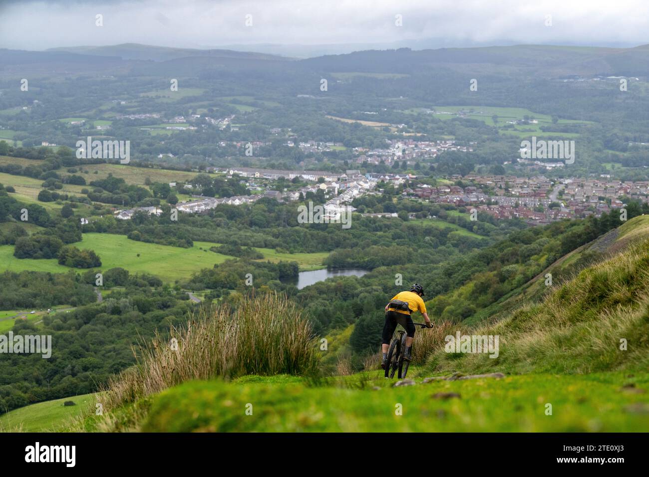 A man rides a mountain bike in Rhondda Cynon Taf in South Wales. Stock Photo