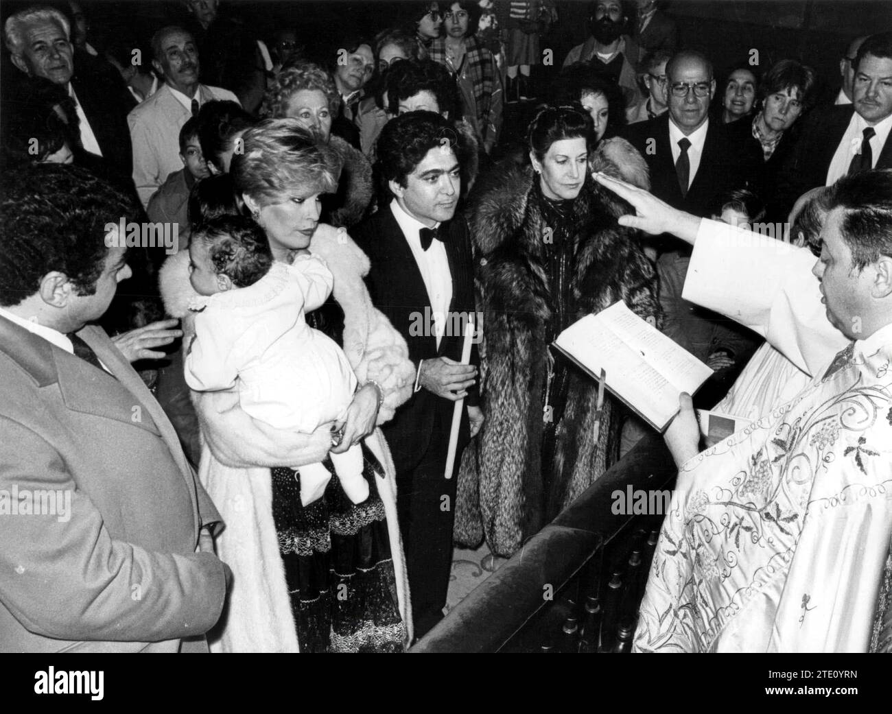 MADRID, 12/15/1981.- The baptism of the son of Barbara Rey and Ángel Cristo.- In the Madrid parish of San Jerónimo el Real, the baptismal ceremony of the son of Barbara Rey and Ángel Cristo took place, who received the name of his father. The religious ceremony, offered by the circus chaplain and sponsored by Hortensia Blázquez and Manuel Martín Ferrand, was followed by a nice party under the tent. Credit: Album / Archivo ABC / Luis Ramírez Stock Photo