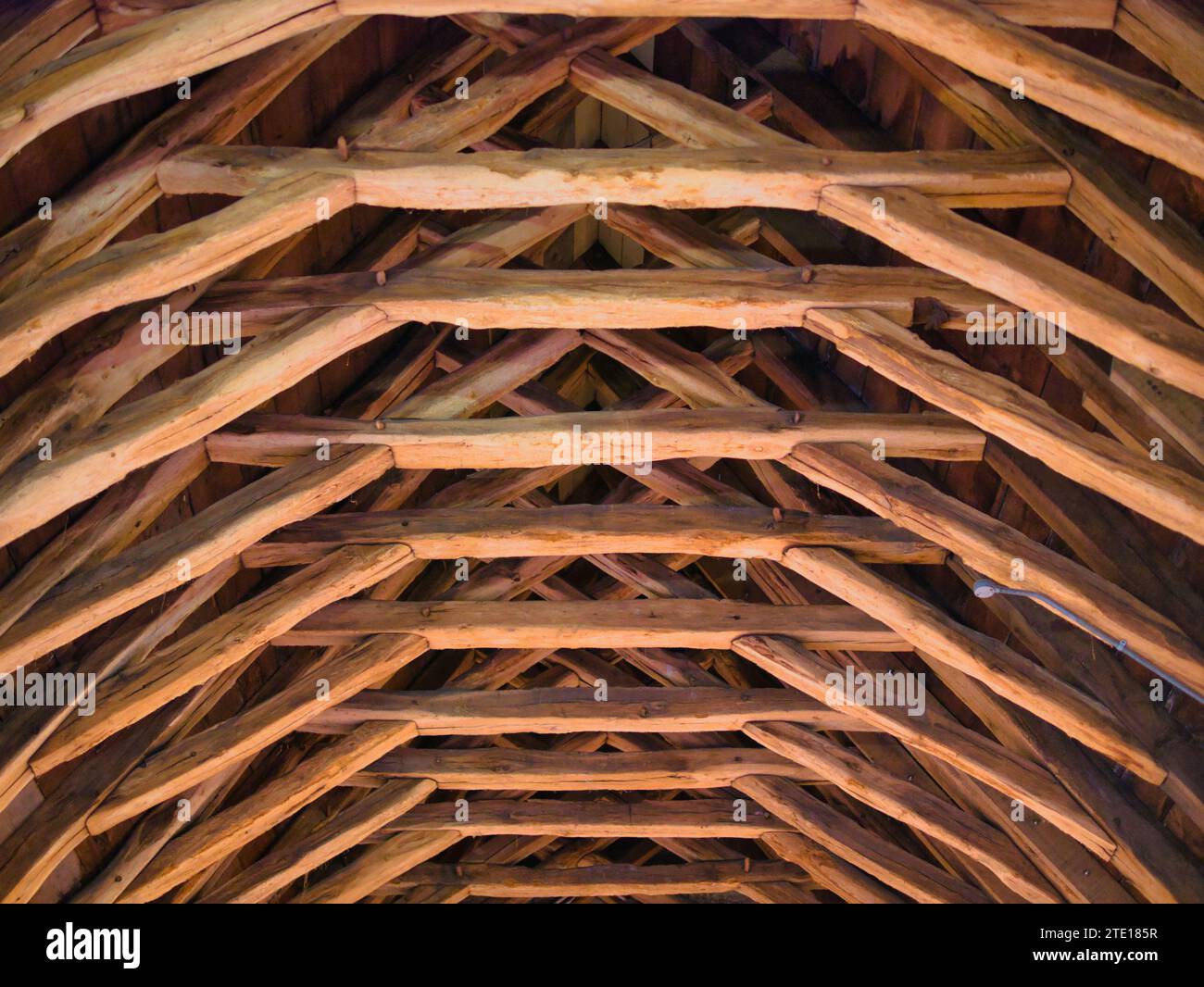 York, UK - Nov 23 2023: Scissor-braced trusses in the medieval roof of the Masons' Loft Stock Photo