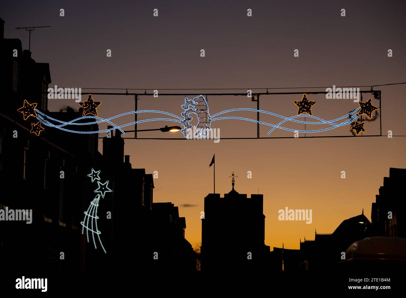 Christmas lights in High Street and Westgate chapel at sunset, Warwick