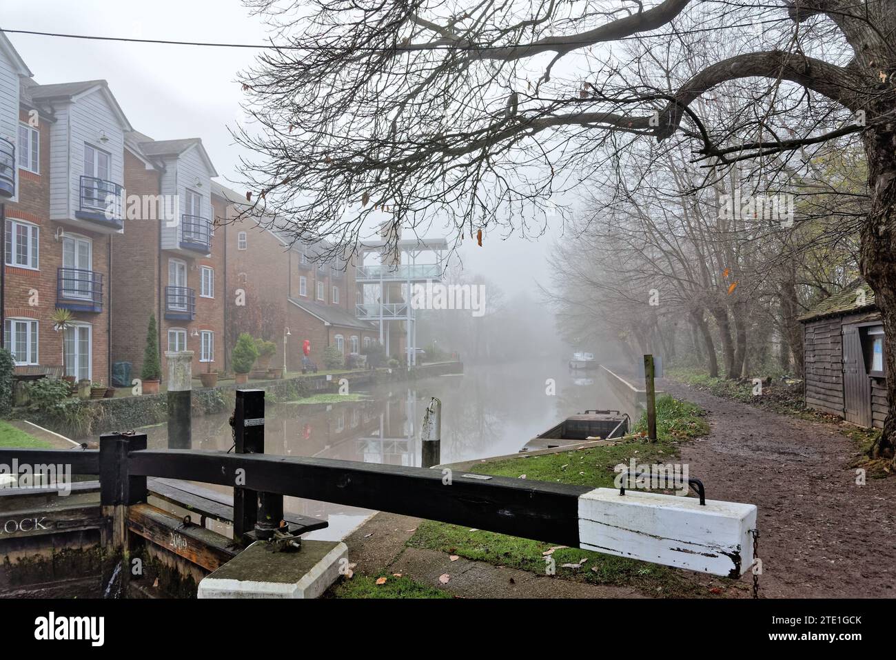 The River Wey navigation canal at Thames lock on a very foggy and misty ...