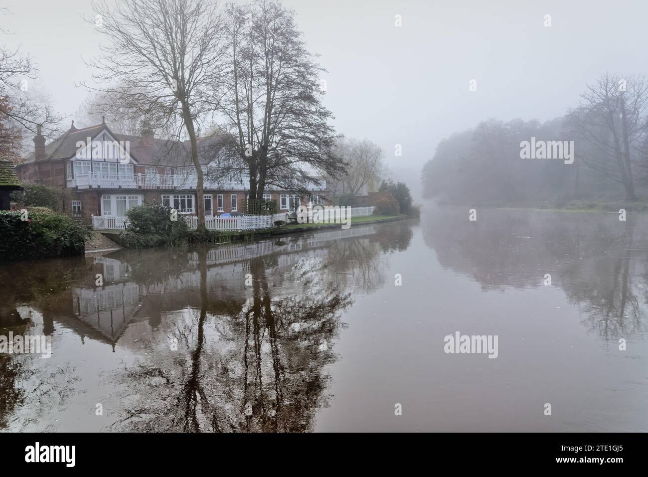 The River Wey navigation canal on a cold and foggy winter's  day Weybridge Surrey England UK Stock Photo