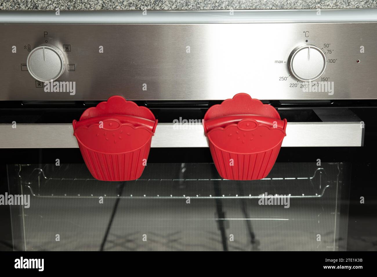 Oven mitts made of red plastic material Stock Photo Alamy