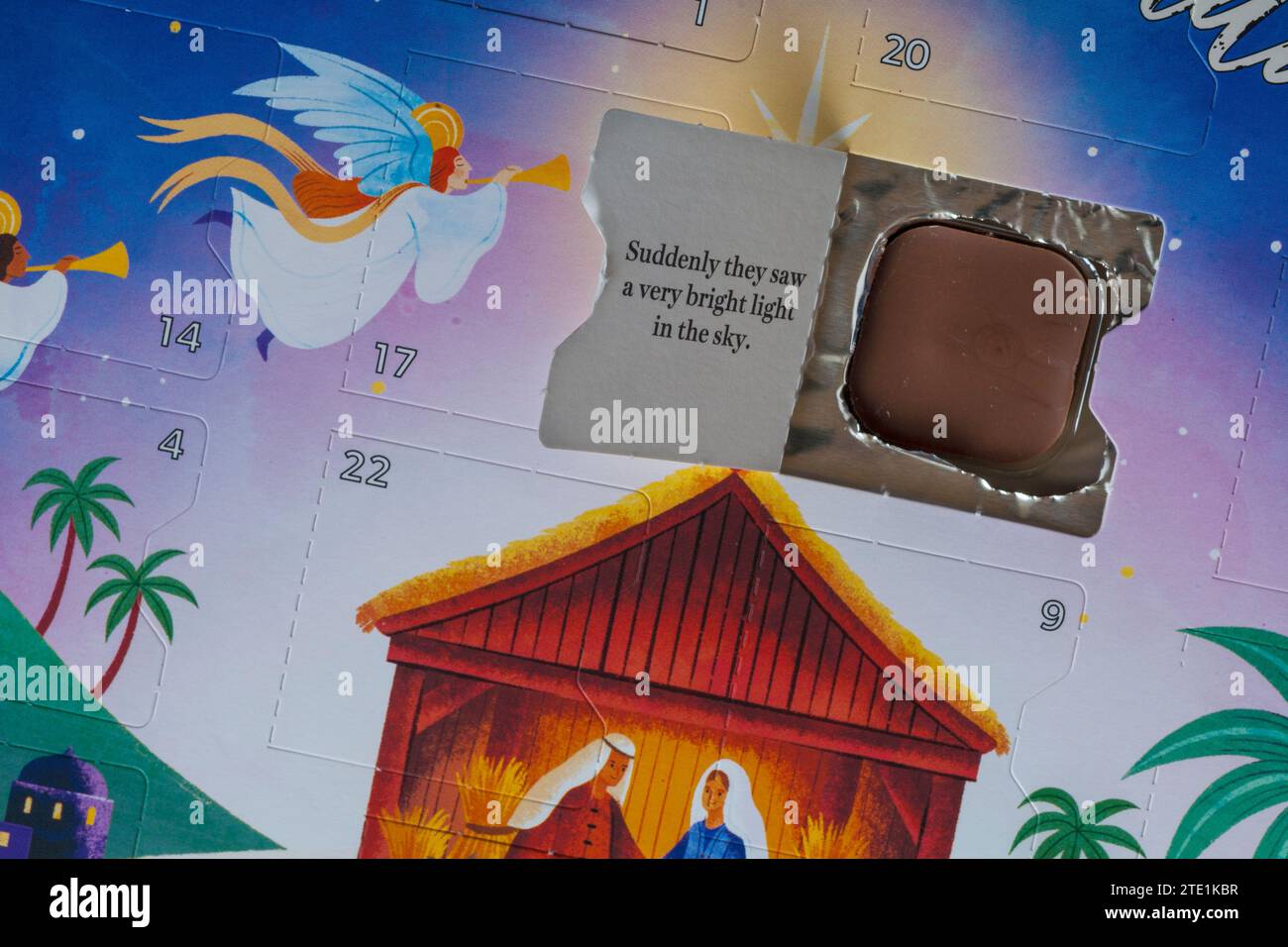 Open door on nativity advent calendar showing chocolate and part of the nativity story Stock Photo