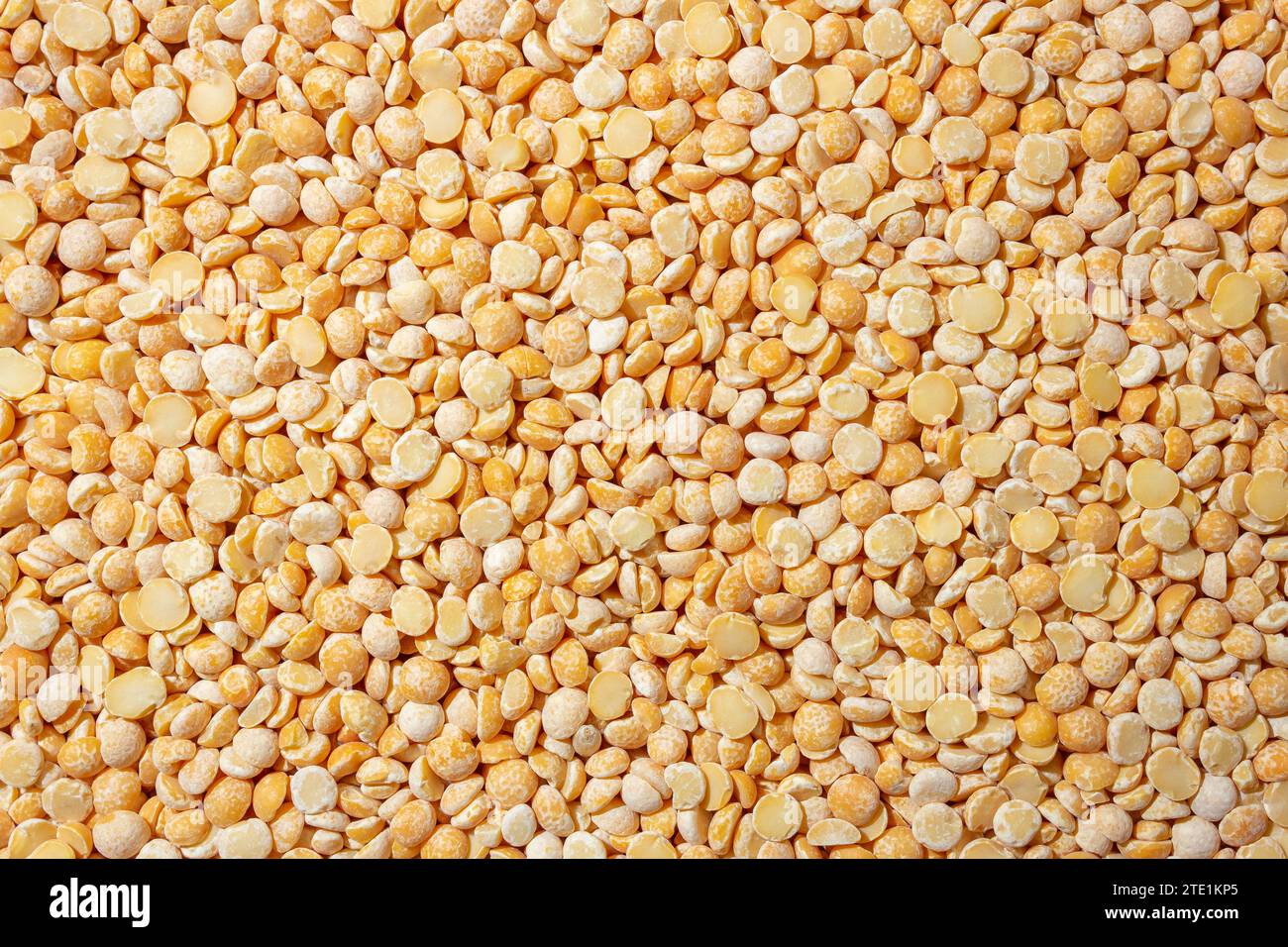 Uncooked Polished Split Peas Background. A Culinary Canvas of Dry