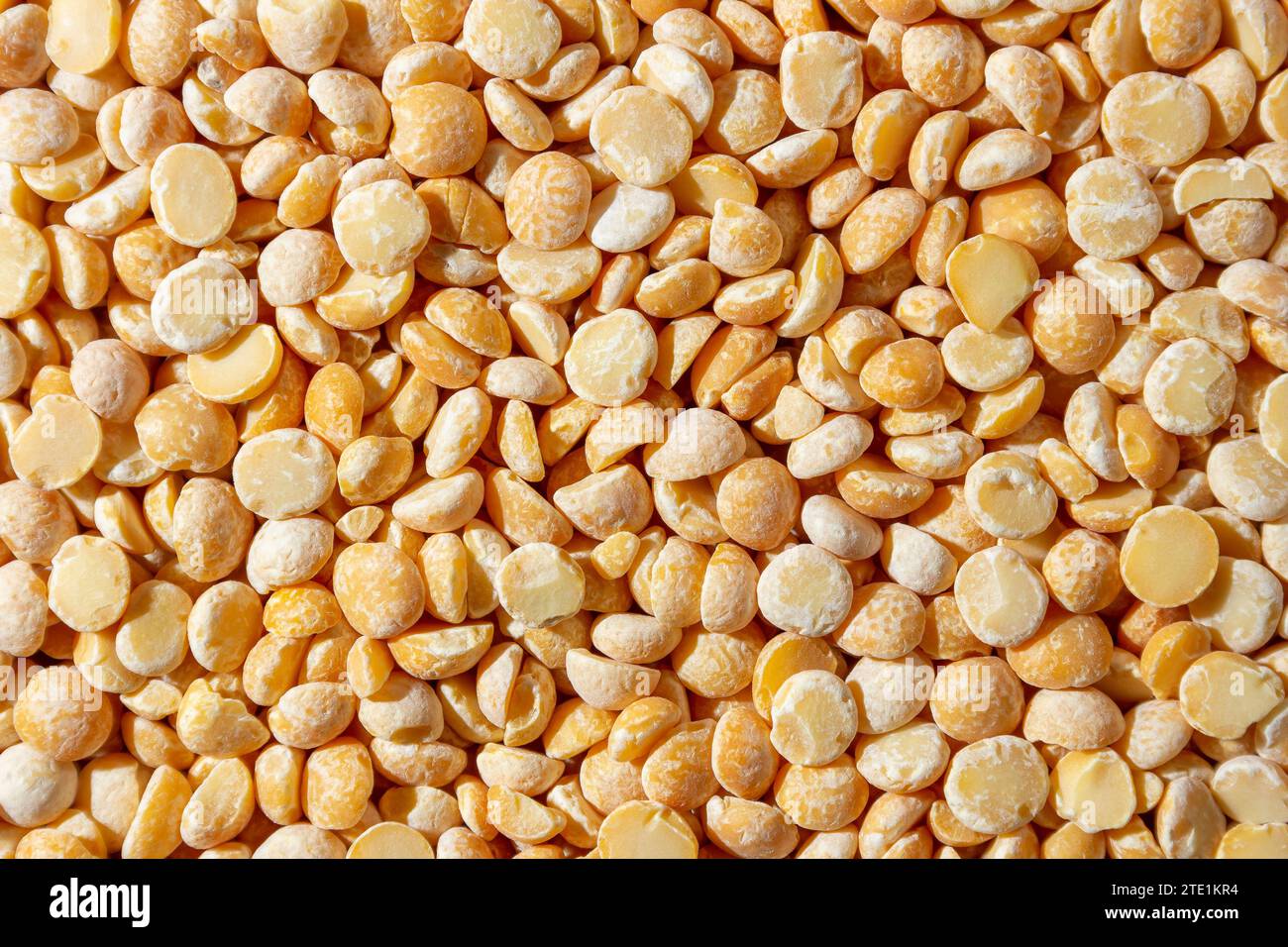 Uncooked Polished Split Peas Background. A Culinary Canvas of Dry