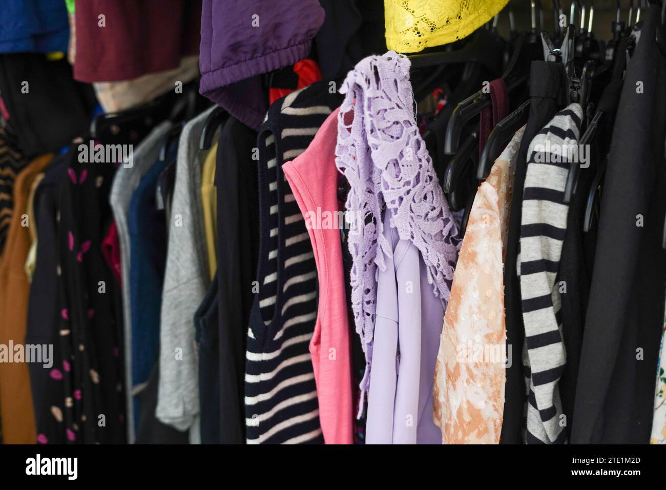 A second hand clothes shop with a lot of clothes at reasonable prices