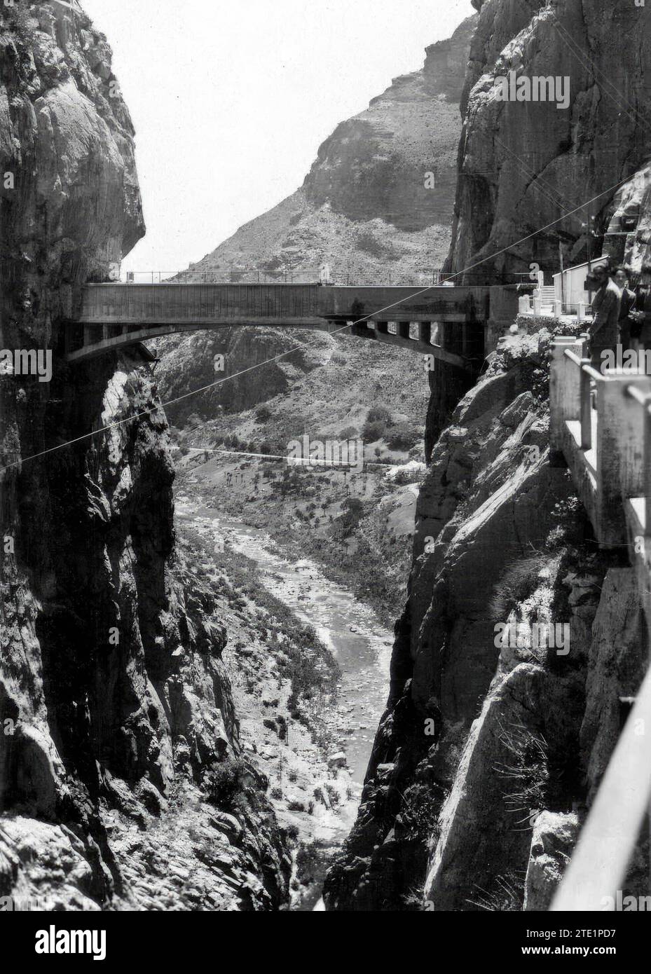 12/31/1924. Gitanes Gorge (Málaga). The gorge runs between the municipalities of Ardales, Álora and Antequera, next to the village and the El Chorro reservoir. There is a three-kilometer-long path that was built for maintenance workers to access the El Chorro reservoir, hanging from the walls of the gorge. King Alfonso XIII visited it in 1921 and since then it began to be known as Caminito del Rey. In the image, the Giants Bridge. Credit: Album / Archivo ABC / Carlos Aguilera Bazán Stock Photo