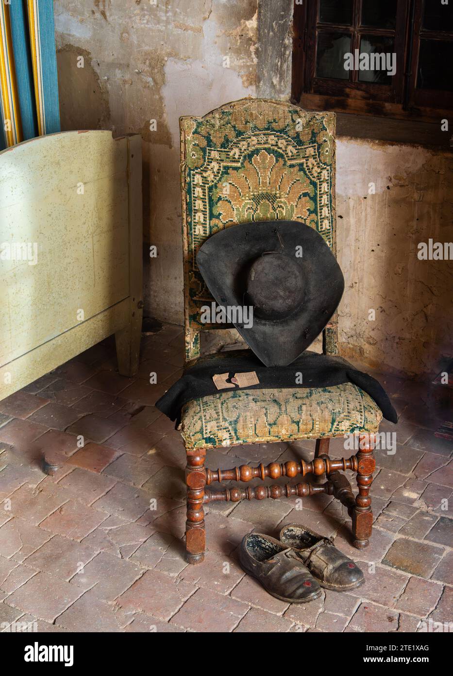 Ars, France - October 13, 2023: Ars, France - October 13, 2023: Hat, shoes and scarf in the home of saint Jean Marie Vianney, patron saint of all the Stock Photo