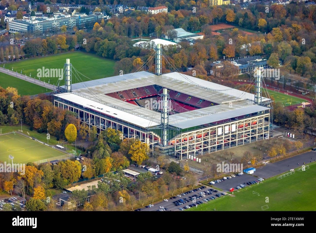 Aerial view, Bundesliga stadium RheinEnergieStadion of 1. FC Köln, formerly Müngersdorfer Stadion soccer pitch and training grounds surrounded by autu Stock Photo