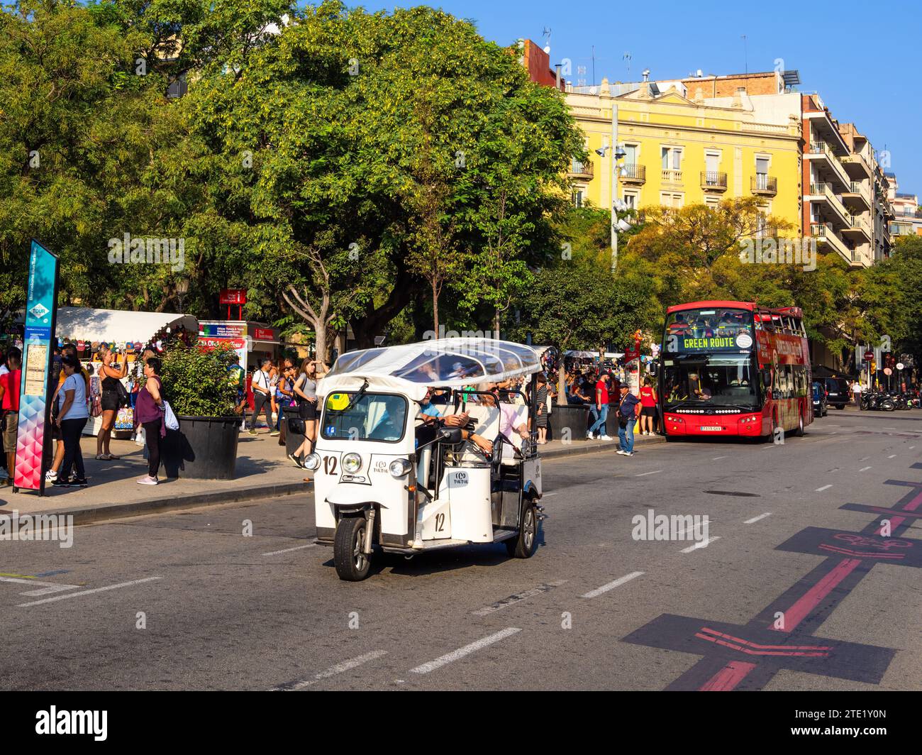 Barcelona, Spain - October 7, 2023: Tourism in Barcelona - city transport and tourist tours with motorised rickshaw or red hip-hop bus Stock Photo