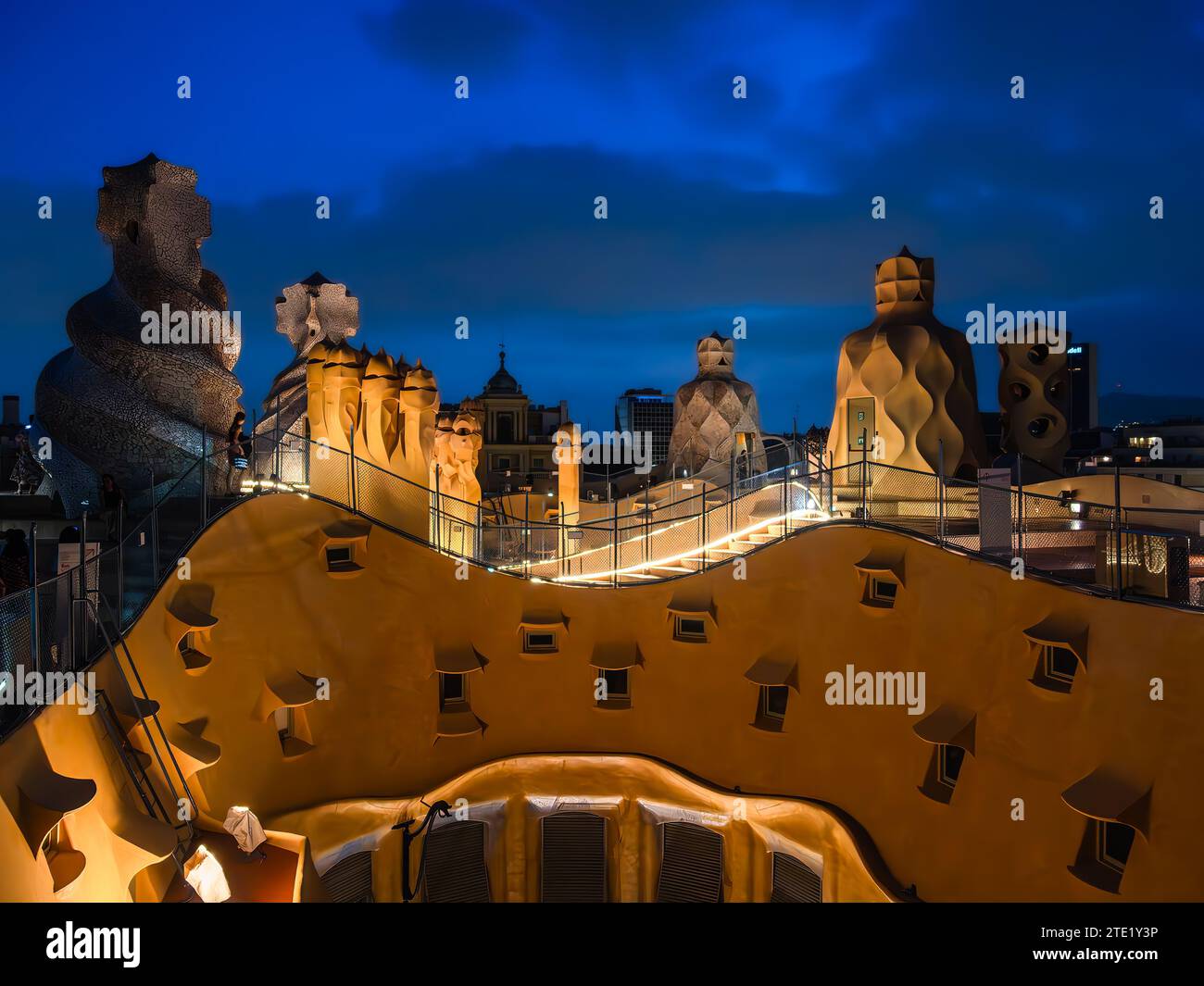 Barcelona, Spain - October 7, 2023: Illuminated roof sculptures - ventilation shafts - of Casa Mila, also called La Pedrera, made by the Catalan archi Stock Photo