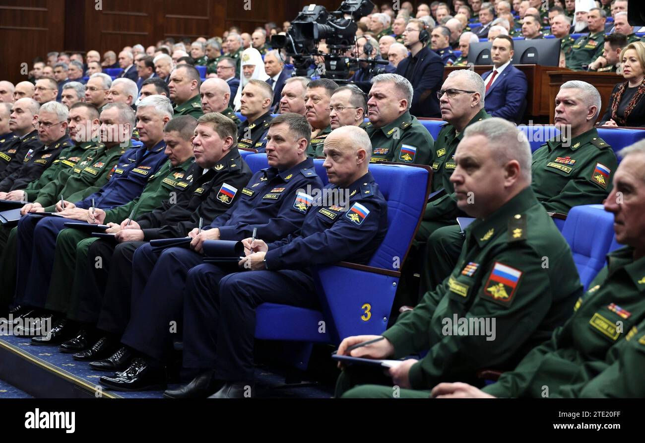 Moscow, Russia. 20th Dec, 2023. Senior Russian military officers listen to President Vladimir Putin deliver remarks during the expanded meeting of the Defense Ministry Board at the National Defence Control Centre, December 19, 2023 in Moscow, Russia. Credit: Mikhail Klimentyev/Kremlin Pool/Alamy Live News Stock Photo