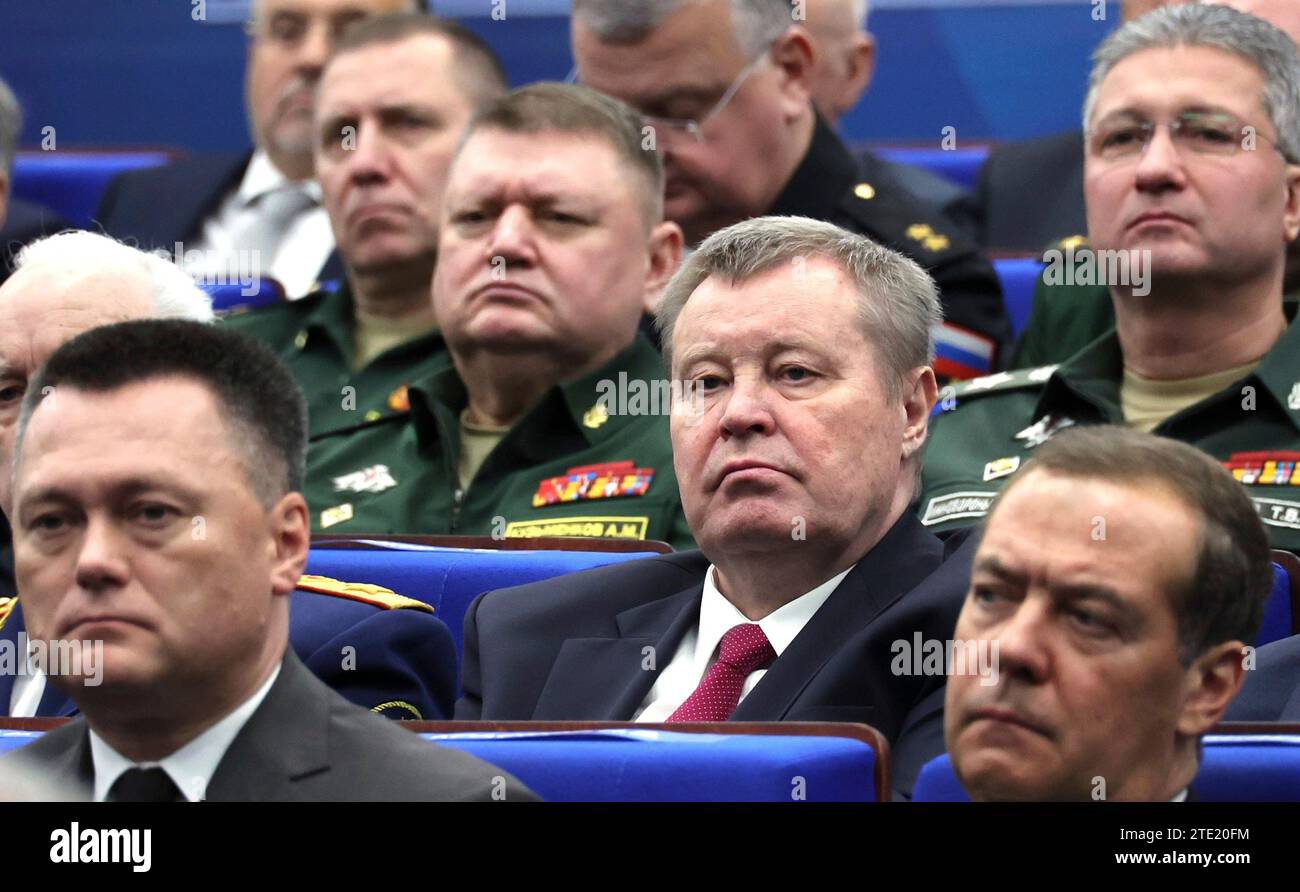 Moscow, Russia. 19th Dec, 2023. Russian Presidential Envoy to the Southern Federal District Vladimir Ustinov, center, Senior Russian military officers and civilian leaders listen to President Vladimir Putin deliver remarks during the expanded meeting of the Defense Ministry Board at the National Defence Control Centre, December 19, 2023 in Moscow, Russia. Credit: Mikhail Klimentyev/Kremlin Pool/Alamy Live News Stock Photo