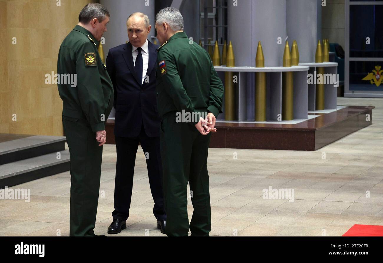 Moscow, Russia. 19th Dec, 2023. Russian President Vladimir Putin speaks with Armed Forces chief of staff Valery Gerasimov, left, and Defence Minister Sergei Shoigu, right, at the National Defence Control Centre, December 19, 2023 in Moscow, Russia. Credit: Mikhail Klimentyev/Kremlin Pool/Alamy Live News Stock Photo